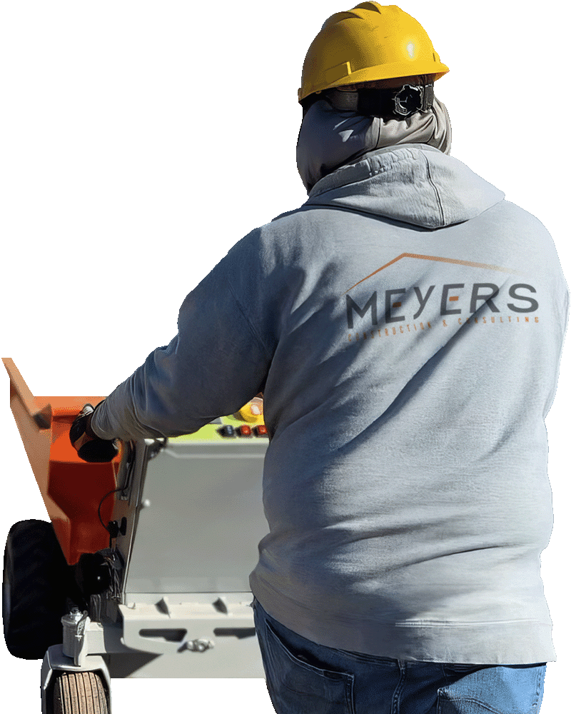Meyers employee hauls material.